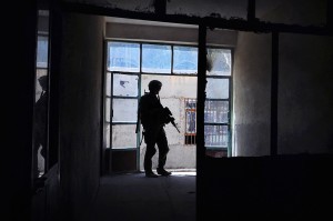 A U.S. Army soldier provides security at a school in Farah City, Afghanistan, on Aug. 1, 2012. (Photo credit: U.S. Navy Lt. Benjamin Addison)