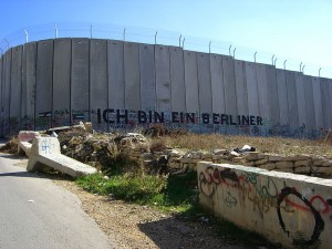 A section of the barrier -- erected by Israeli officials to prevent the passage of Palestinians -- with graffiti using President John F. Kennedy's famous quote when facing the Berlin Wall, "Ich bin ein Berliner." (Photo credit: Marc Venezia)