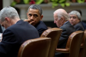 President Barack Obama, with Vice President Joe Biden, attends a meeting in the Roosevelt Room of the White House, Dec. 12, 2013. (Official White House Photo by Pete Souza)