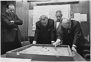 National Security Adviser Walt Rostow shows President Lyndon Johnson a model of a battle near Khe Sanh in Vietnam., From ImagesAttr