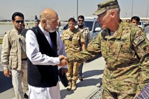 Afghan President Hamid Karzai greeting U.S. Army Lt. Gen. James L. Terry in Kabul, Afghanistan, in March 2013.