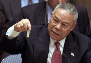 U.S. Secretary of State Colin Powell presents a dummy vial of anthrax on Feb. 5, 2003, during a speech to the UN Security Council outlining the American case that Iraq possessed forbidden stockpiles of WMD. 
