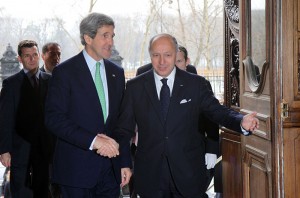 French Foreign Minister Laurent Fabius greets U.S. Secretary of State John Kerry in Paris, France, on Feb. 27, 2013. [State Department photo]