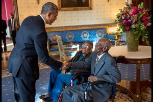 President Barack Obama greets Richard Overton, with Earlene Love-Karo, in the Blue Room of the White House, Nov. 11, 2013. Mr. Overton,107 years old and the oldest living World War II veteran, attended the Veteran's Day Breakfast at the White House. (Official White House Photo by Lawrence Jackson)