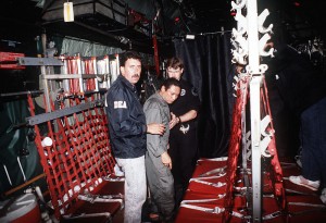 As an example of a U.S.-trained military officer gone bad, Gen. Manuel Noriega is escorted onto a U.S. Air Force aircraft by agents from the U.S. Drug Enforcement Agency after his arrest on Jan. 1, 1990. (U.S. military photo)