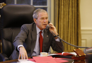 President George W. Bush speaks on the phone in the Oval Office, Oct. 7, 2008, with Prime Minister Gordon Brown of the United Kingdom, discussing efforts to solve the spreading global financial crisis. (White House photo by Eric Draper)