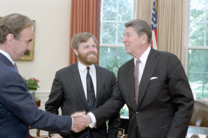 President Ronald Reagan meets with Charles Douglas Home, editor of London Times, and its publisher Rupert Murdoch in the Oval Office on July 7, 1983. (Photo credit: Reagan presidential library) 