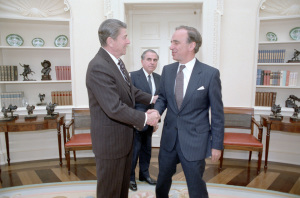 President Ronald Reagan meeting with media magnate Rupert Murdoch in the Oval Office on Jan. 18, 1983, with Charles Wick, director of the U.S. Information Agency, the the background. (Credit: Reagan presidential library)