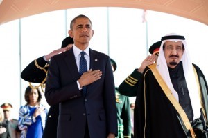 President Obama and King Salman Arabia stand at attention during the U.S. national anthem as the First Lady stands in the background with other officials on Jan. 27, 2015, at the start of Obama’s State Visit to Saudi Arabia. (Official White House Photo by Pete Souza). (Official White House Photo by Pete Souza)