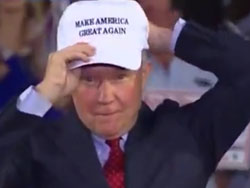 Alabama Sen. Jeff Sessions donning one of Donald Trump's "Make America Great Again" caps.