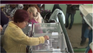 A Ukrainian woman voting in the May 11, 2014 referendum on independence for sections of eastern Ukraine. (Screen shot from RT video)