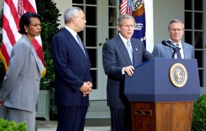 National Security Advisor Condoleezza Rice, Secretary of State Colin Powell, and Secretary of Defense Donald Rumsfeld listen to President George W. Bush speak about the Middle East on June 24, 2002. (Photo from Whitehouse.gov)