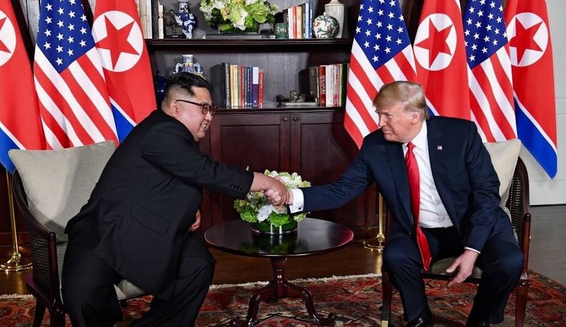 Trump and Kim shaking hands. than a handshake next time. (Wikimedia)