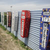Memorial coffins on the US-Mexico barrier for those killed crossing the border fence in Tijuana, México. (Tomas Castelazo, Wikimedia)