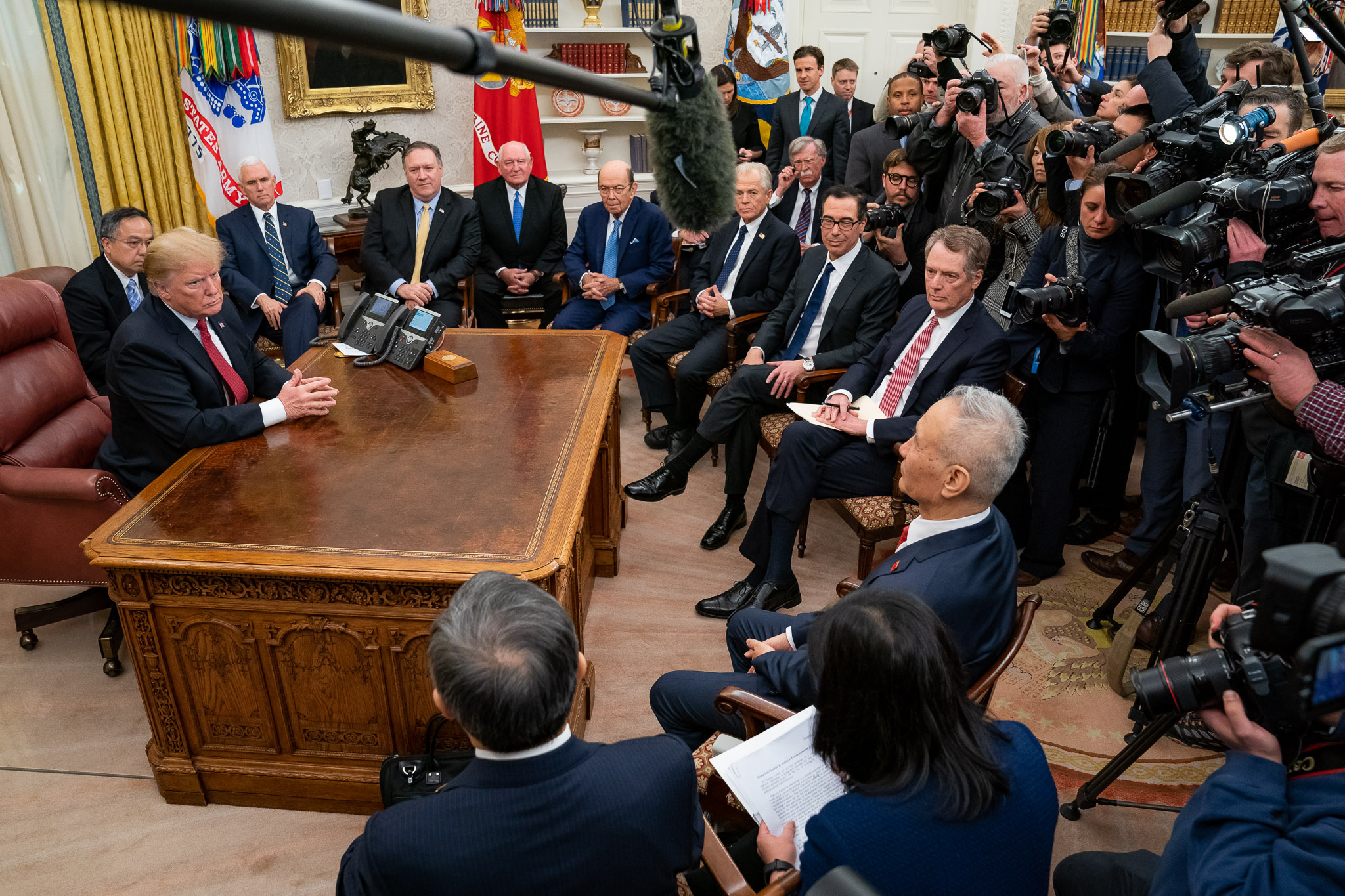 Trump, joined by other U.S. officials, receives Chinese Vice Premier Liu He in Oval Office, January 2019 (Official White House Photo by Tia Dufour via Flickr )