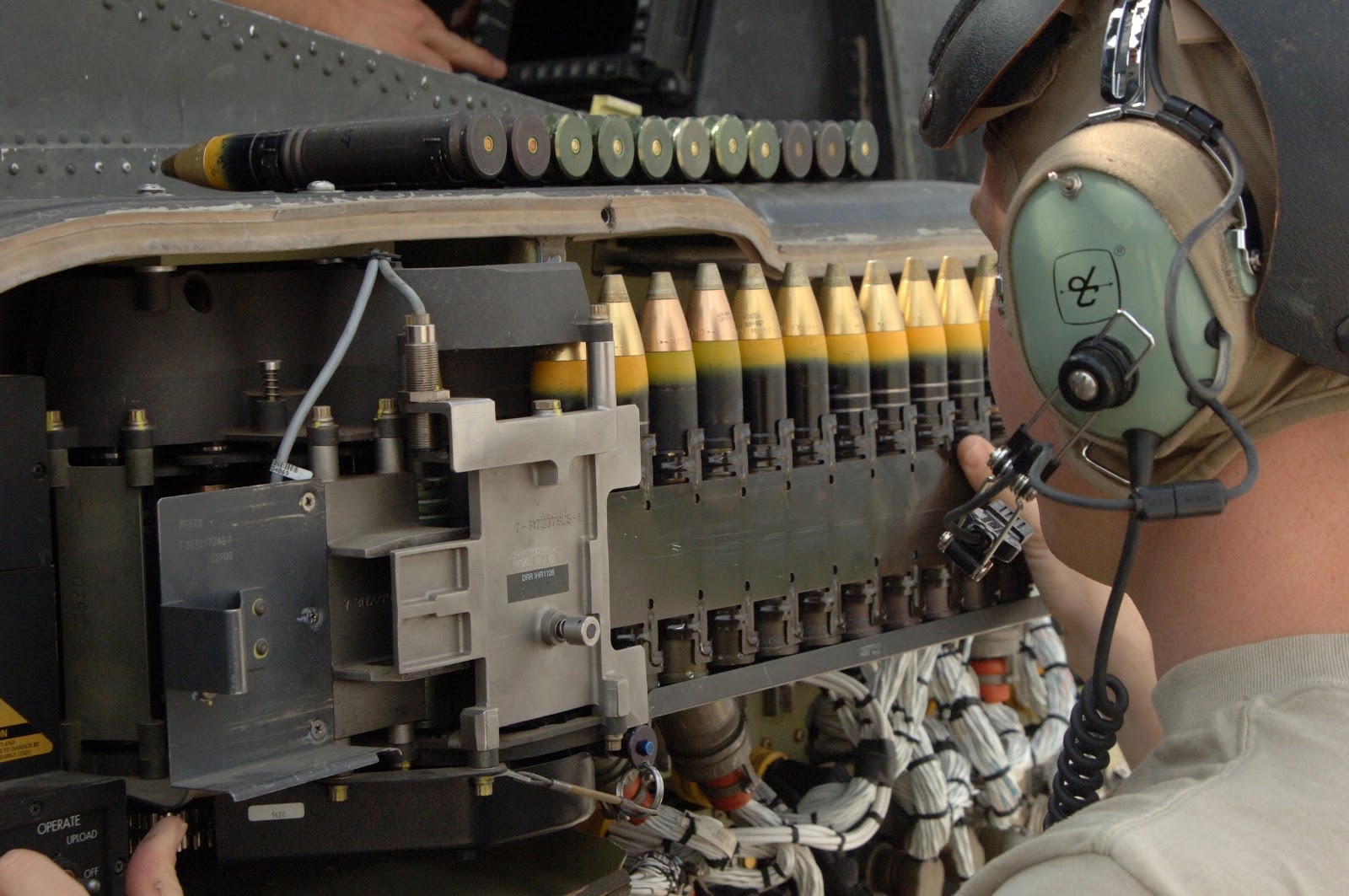 Rounds being loaded into an AH-64D Longbow Apache, April 2007. (Wikimedia Commons)
