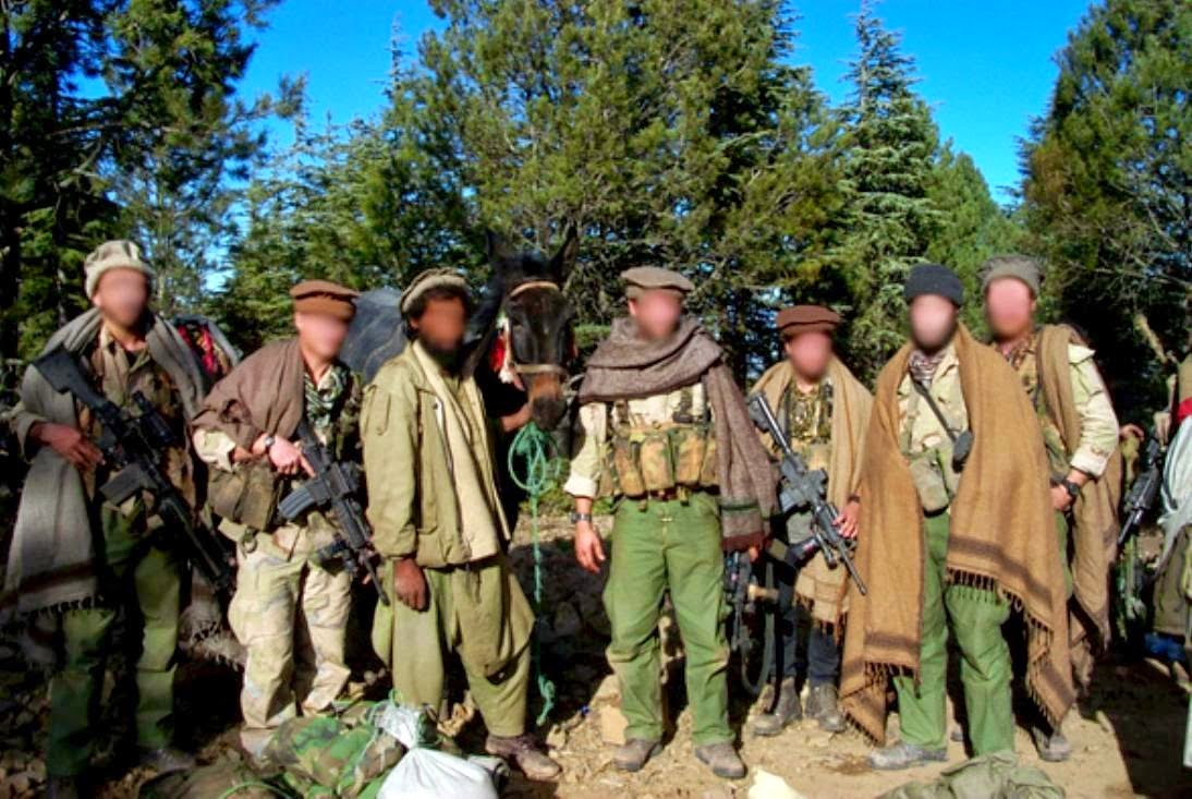 Delta Force GIs disguised as Afghan civilians, while they searched for bin Laden in November 2001. (Wikimedia Commons)