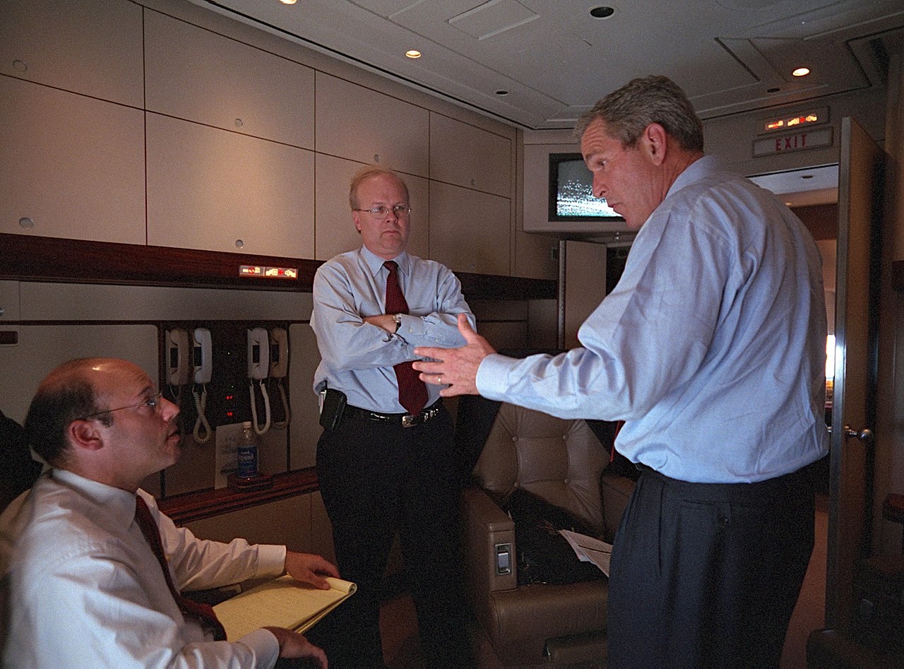 George W. Bush speaks with Ari Fleischer, left, and Karl Rove aboard Air Force One Tuesday, Sept. 11, 2001, during the flight from Offutt Air Force Base in Nebraska to Andrews Air Force Base. (Eric Draper, Courtesy of the George W. Bush Presidential Library)