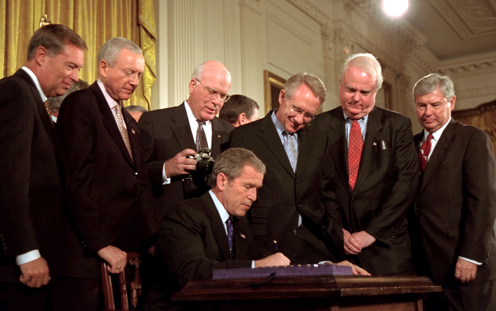 Oct. 26, 2001: President George W. Bush signs the USA Patriot Act in the White House. (U.S. National Archives)
